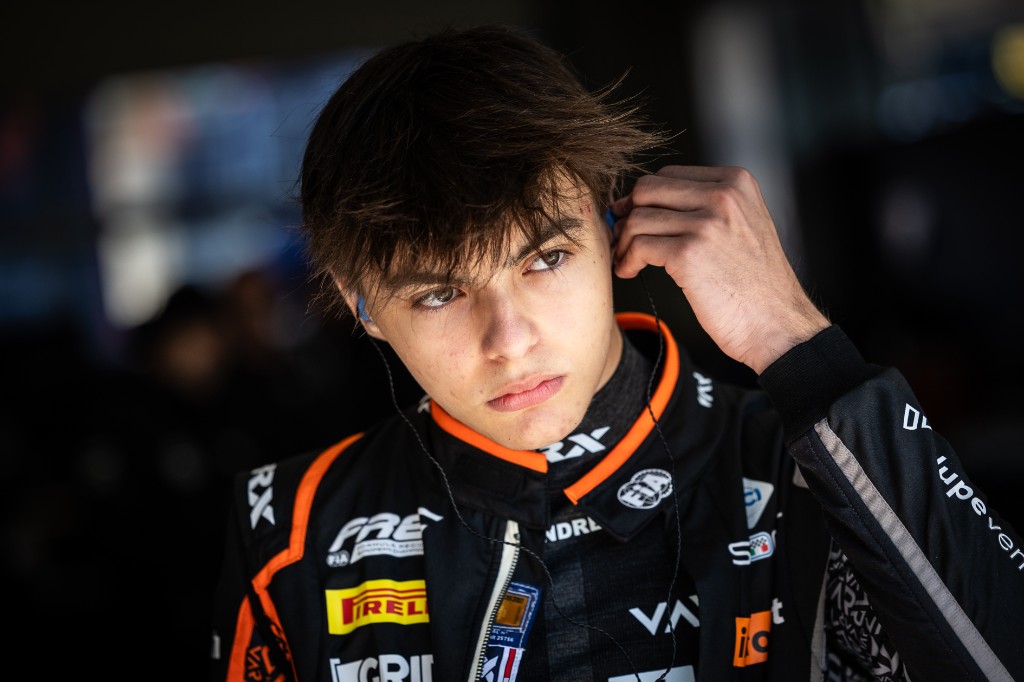 Andrea Dupé in Van Amersfoort Racing race suit — FREC, focused in the garage
