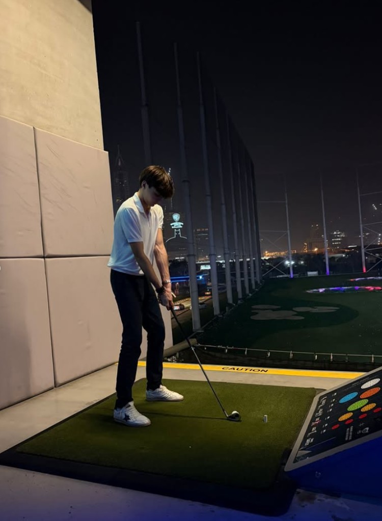 Andrea Dupé playing night golf in Dubai — off-track lifestyle
